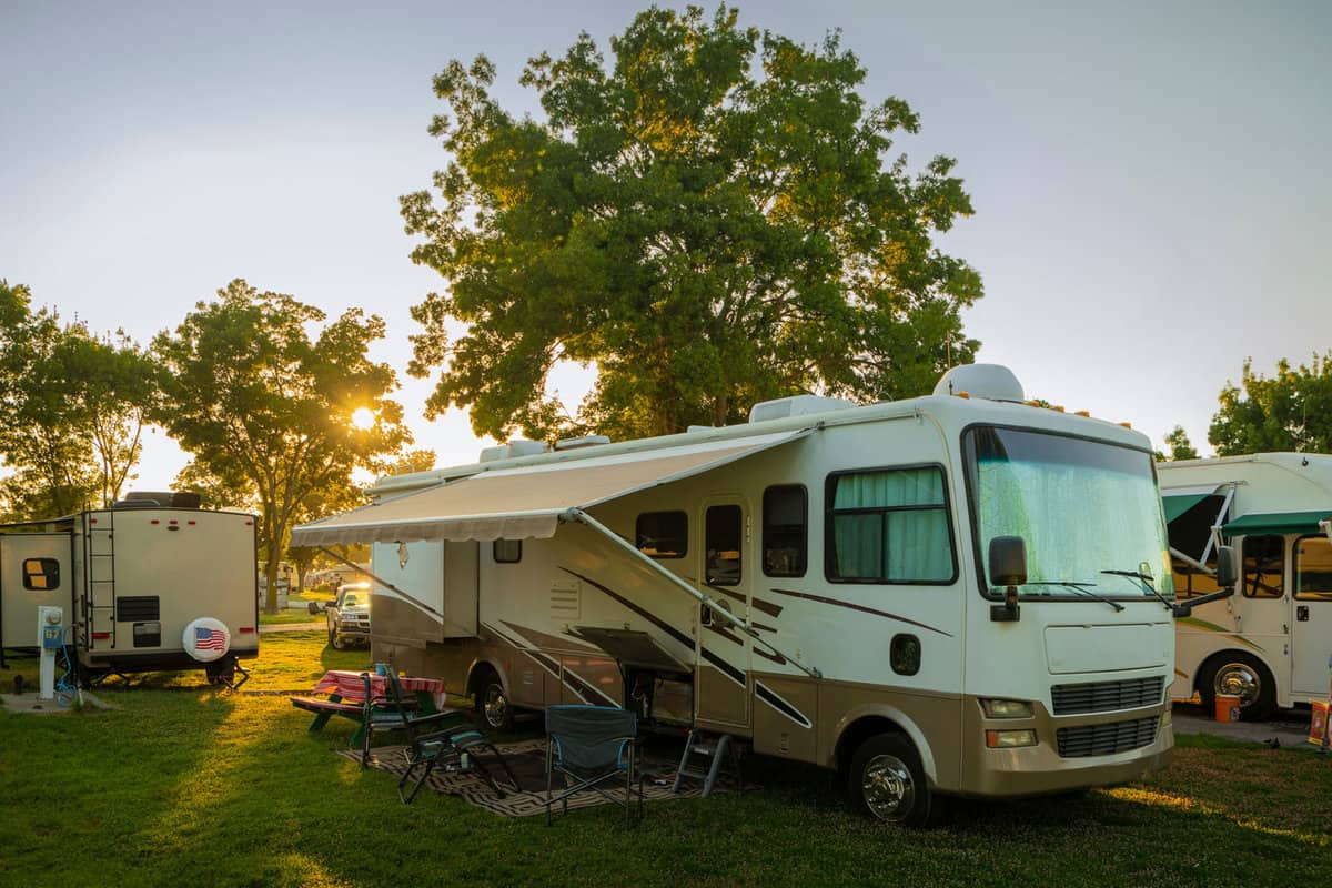 Sun going down at the Rv park with lights on the motor home - Wheels Down In Paradise: The Best RV Parks Near St. Petersburg, Florida