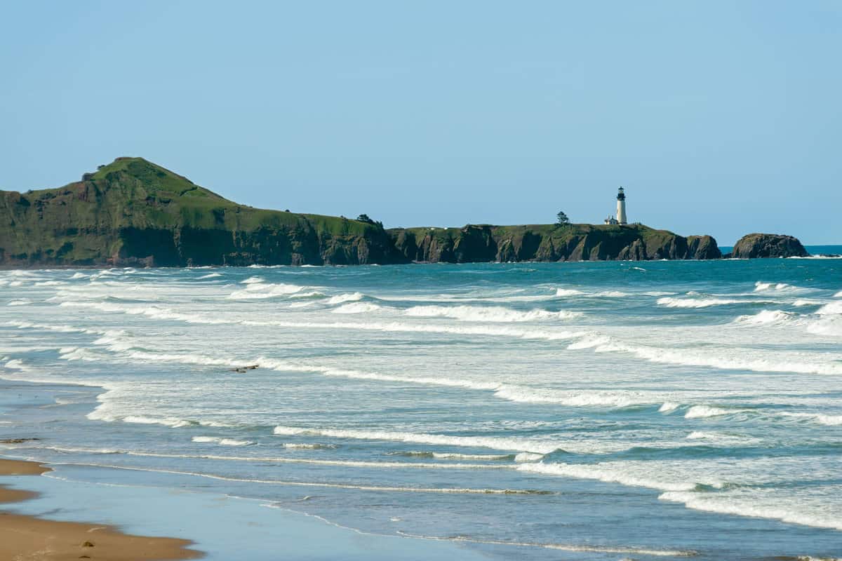 The Yaquina Head Lighthouse as seen from Beverly Beach State Park near Newport, Oregon, USA