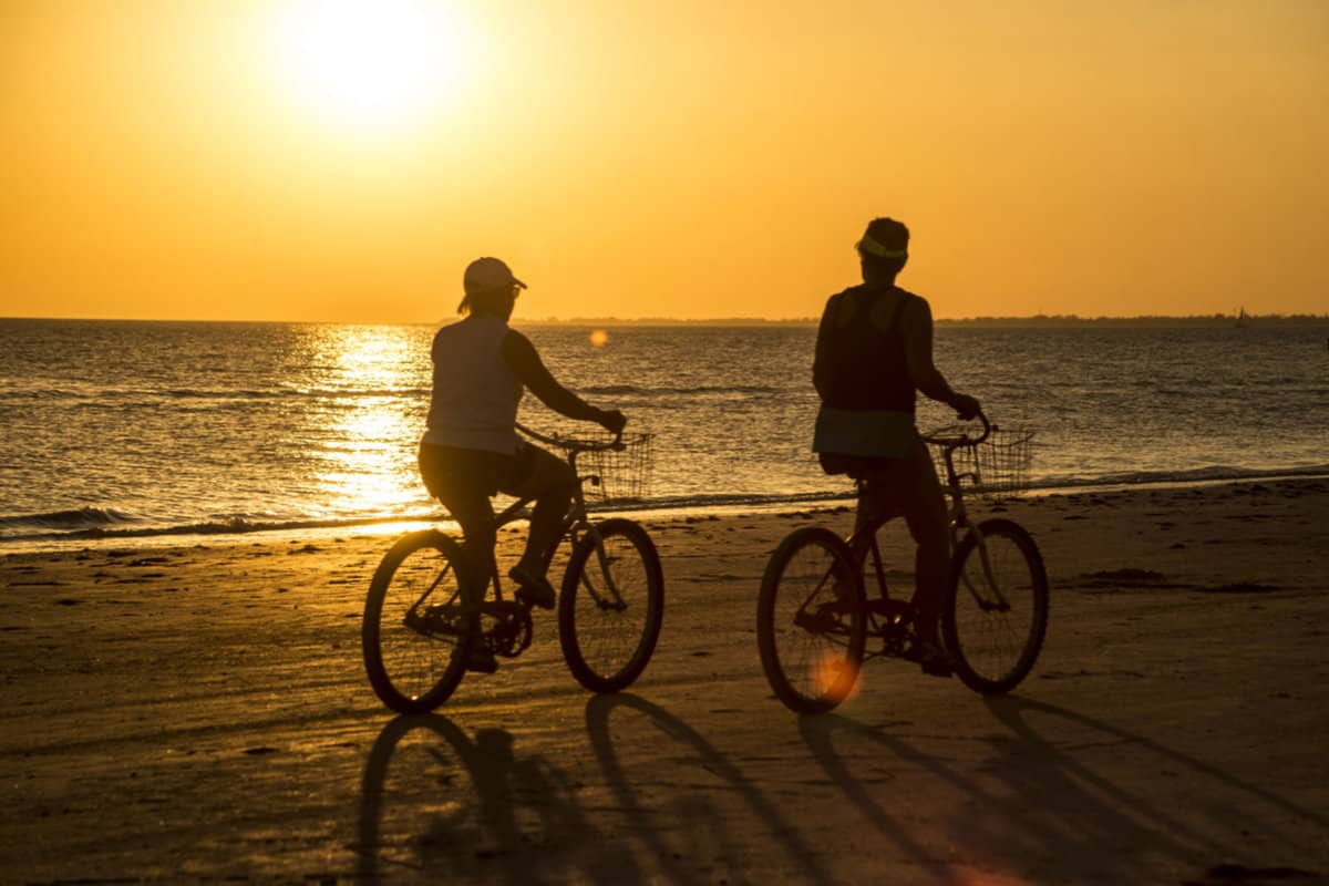 A couple biking near the beaches of Sanibel Island