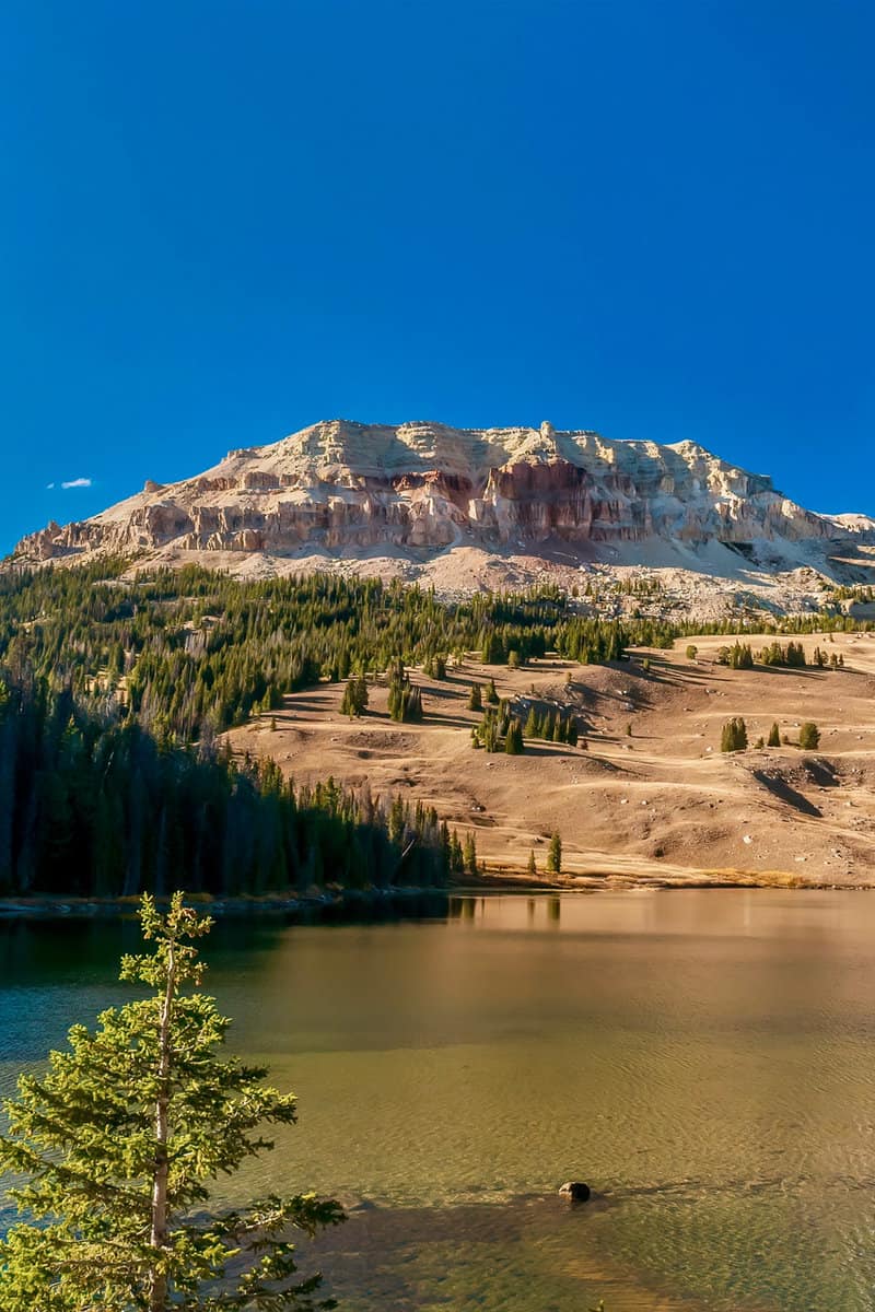 A beautiful American landscape scene, with Beartooth Lake and the ancient geological formation of Beartooth Butte in the background