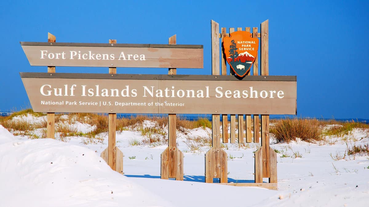 A sign welcomes visitors to the Gulf Islands National Seashore near Pensacola, Florida
