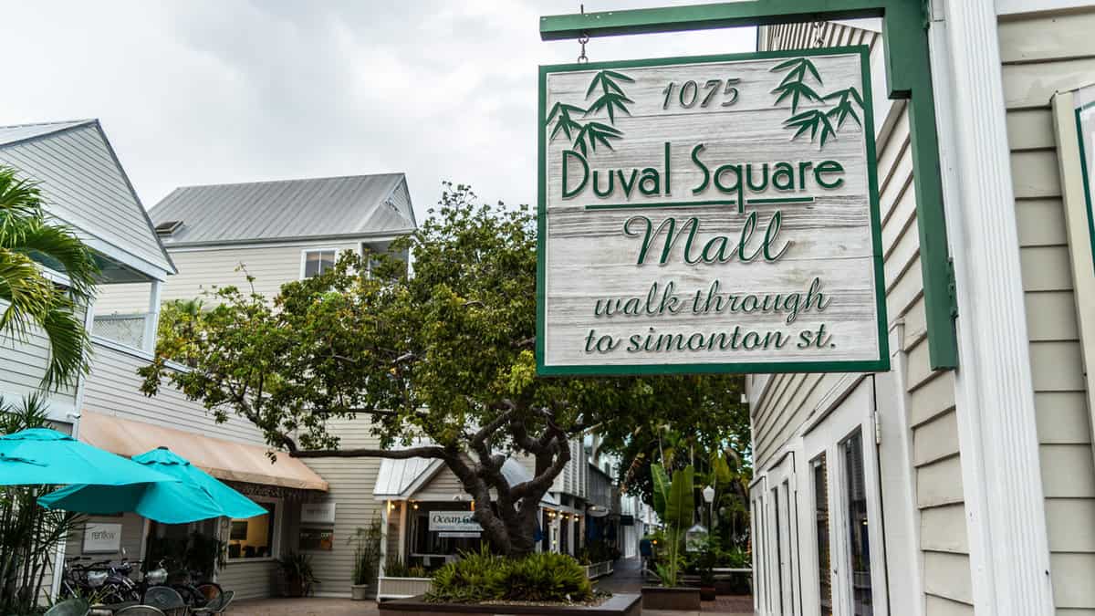 Duval Square Mall Sign With Plaza In Background