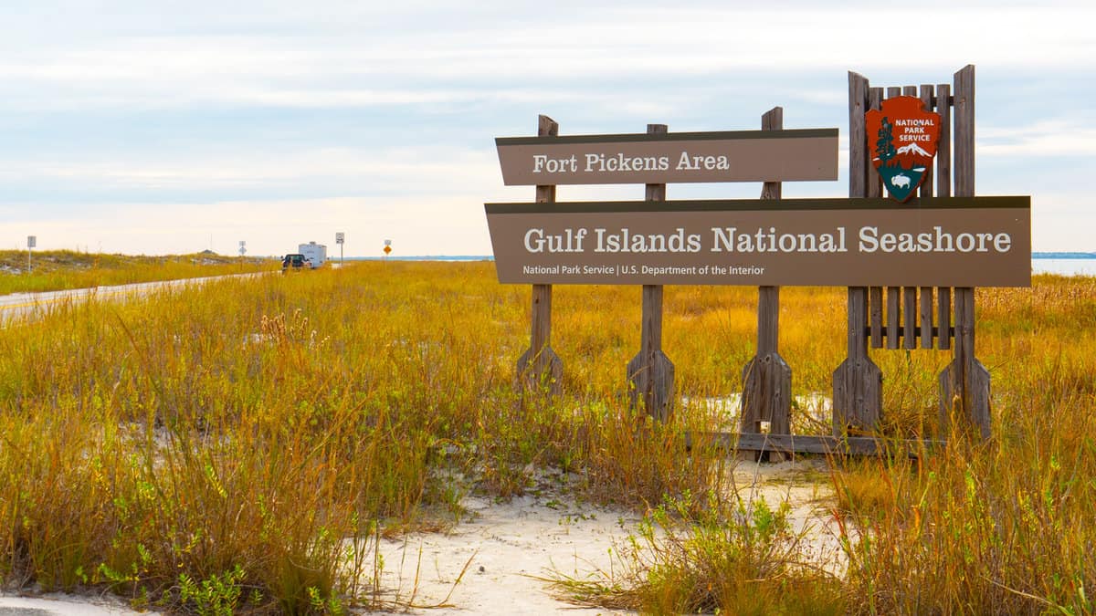 Entrance sign to Fort Pickens on Gulf Islands National Seashore park in Pensacola Florida 1600x900