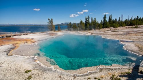The gorgeous Black Pool at West Thumb Geyser Basin, The Black Pool at West Thumb Geyser Basin, a deep azure hot spring in Yellowstone National Park beside Yellowstone Lake - 1600x900