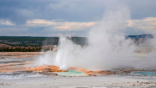 Clepsydra Geyser emitting steam from its crater, The Ultimate Guide to Yellowstone's Geysers: When and Where to Watch Them Erupt - 1600x900