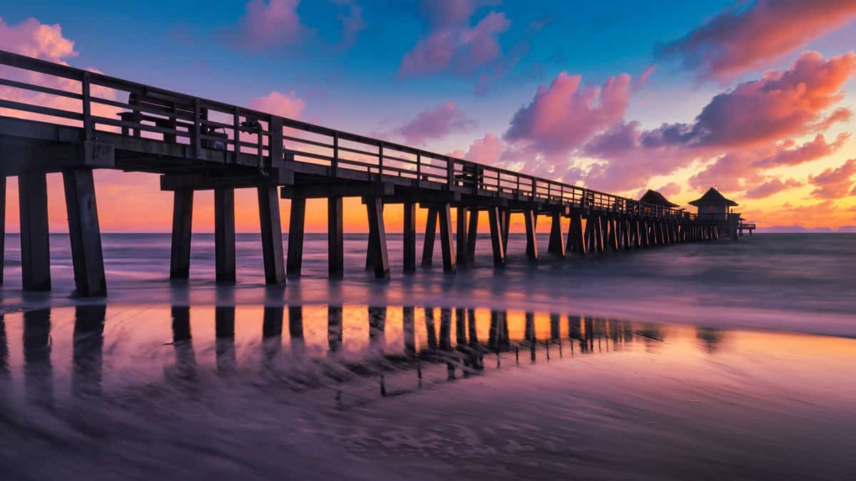 Colorful sunset over the Naples Pier, Naples, Florida, USA