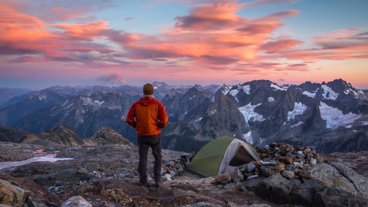 Hiker at sunset in North Cascades National Park 1600x900
