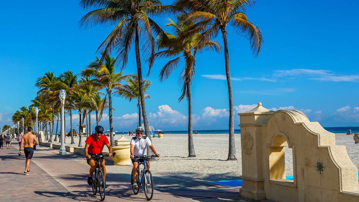 Bicycle rider at the Hollywood Beach Broadwalk in South Florida