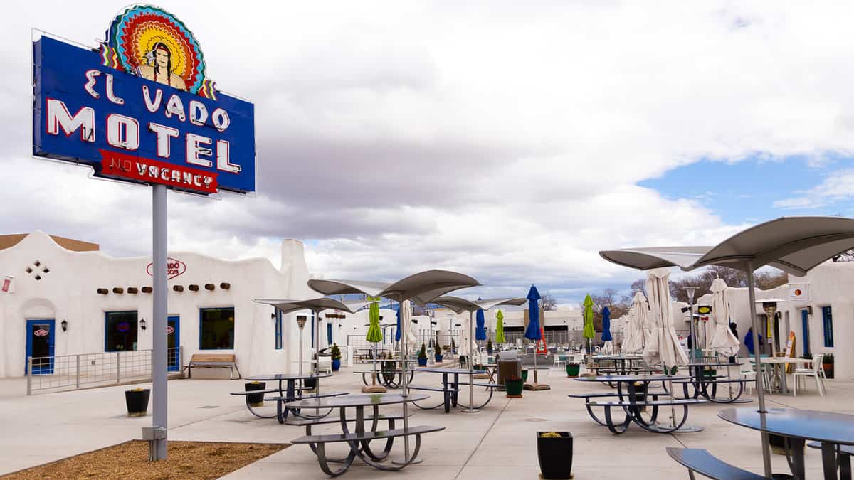Historic 1937 El Vado Motel with its vintage sign and southwest style white units seen during an overcast winter day
