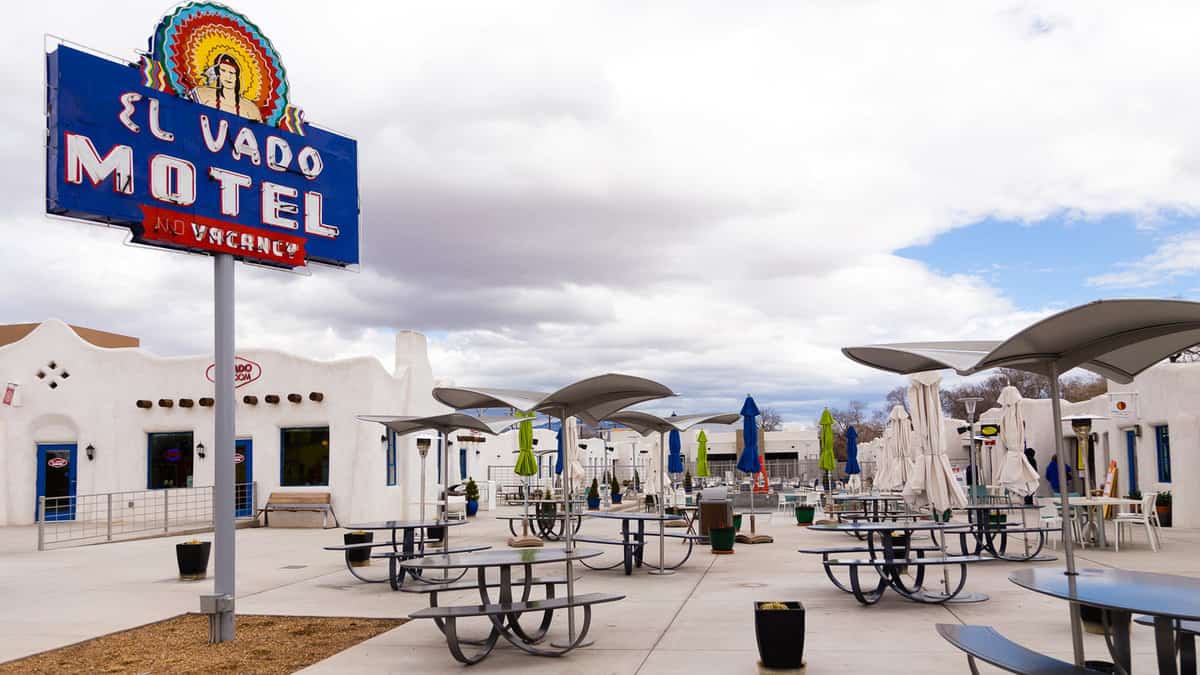 Historic 1937 El Vado Motel with its vintage sign and southwest style white units seen during an overcast winter day