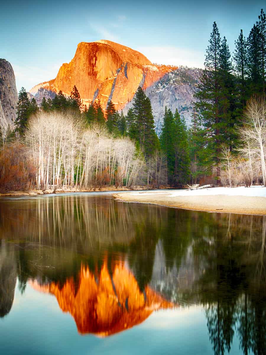 View of half dome at sunset reflected in the Merced River