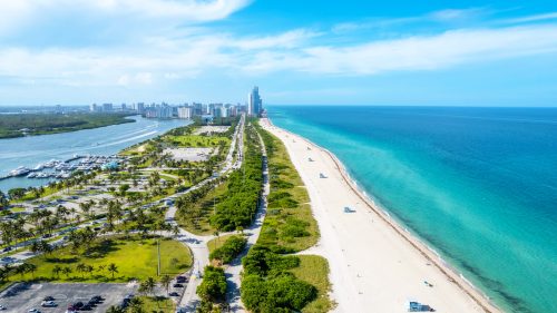 An aerial view of the Haulover beach on a bright sunny day
