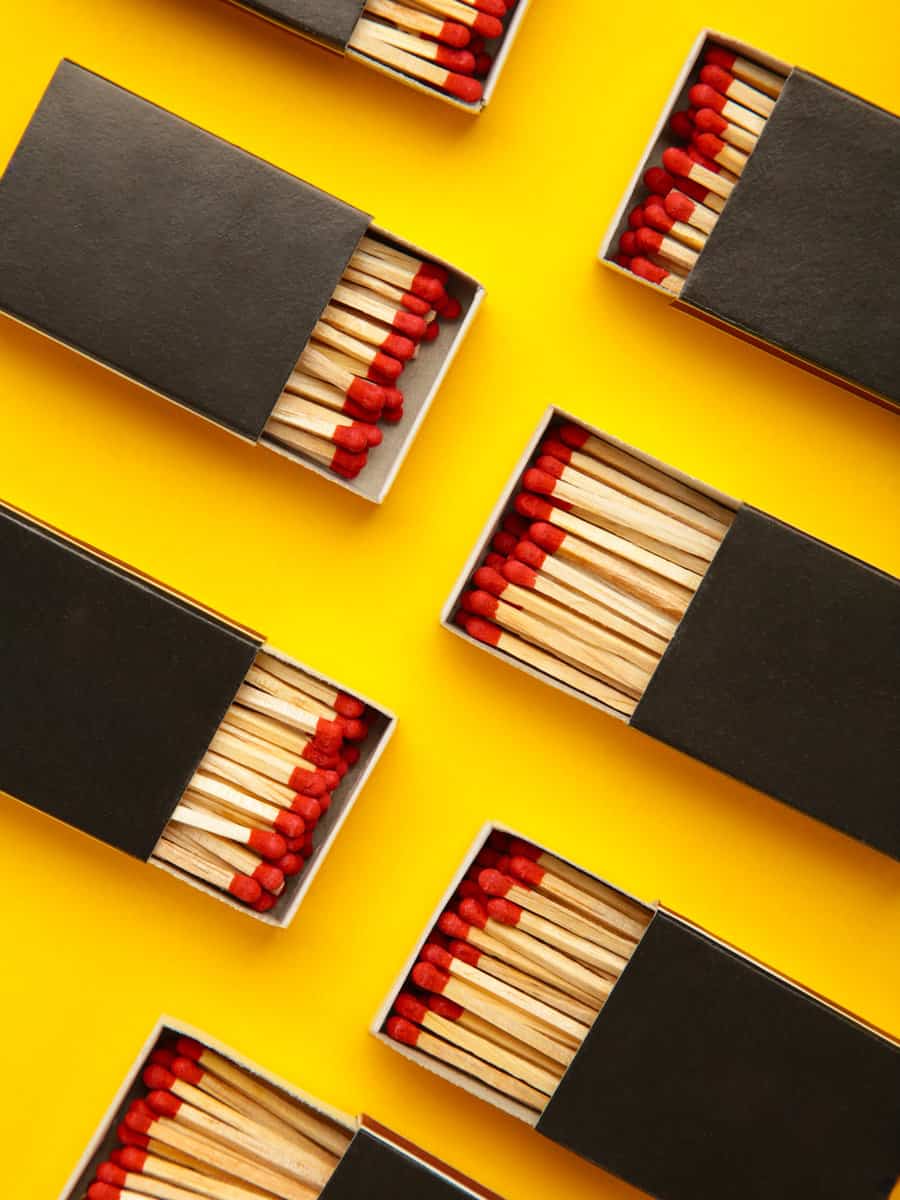 Box of matches on yellow background