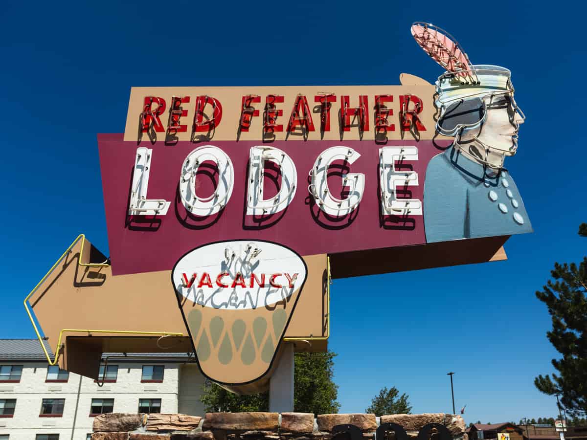 A vintage neon sign for the Red Feather Lodge.