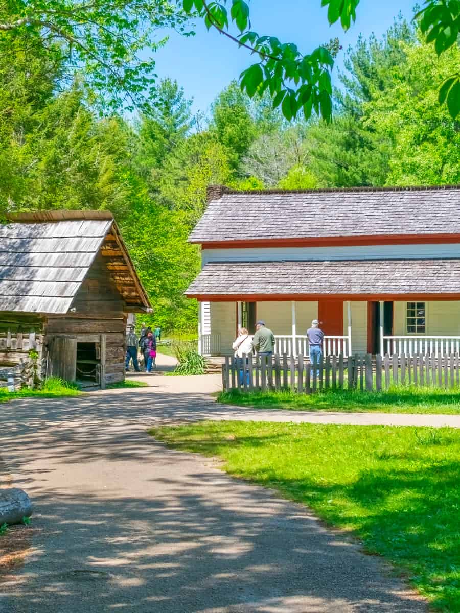Horizontal shot of tourists enjoying the Becky Cable House in Cades Cove