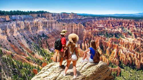 People on hiking trip. Family on top of mountain enjoying time together, looking at beautiful view. Inspiration Point, Bryce Canyon National Park, Utah, USA 1600x900