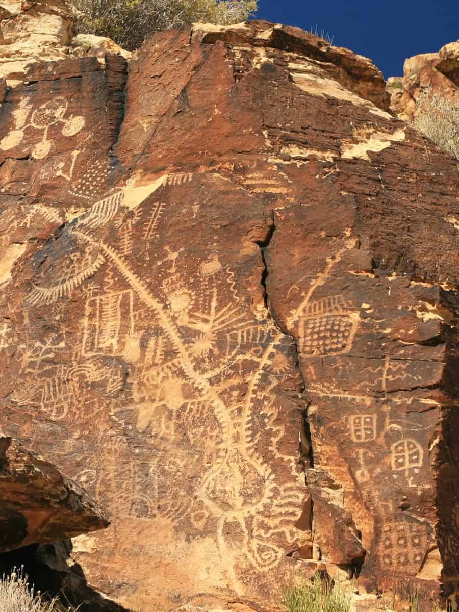 Petroglyphs carved on cliff wall by prehistoric Native American(s) at Parowan Gap, Utah, USA
