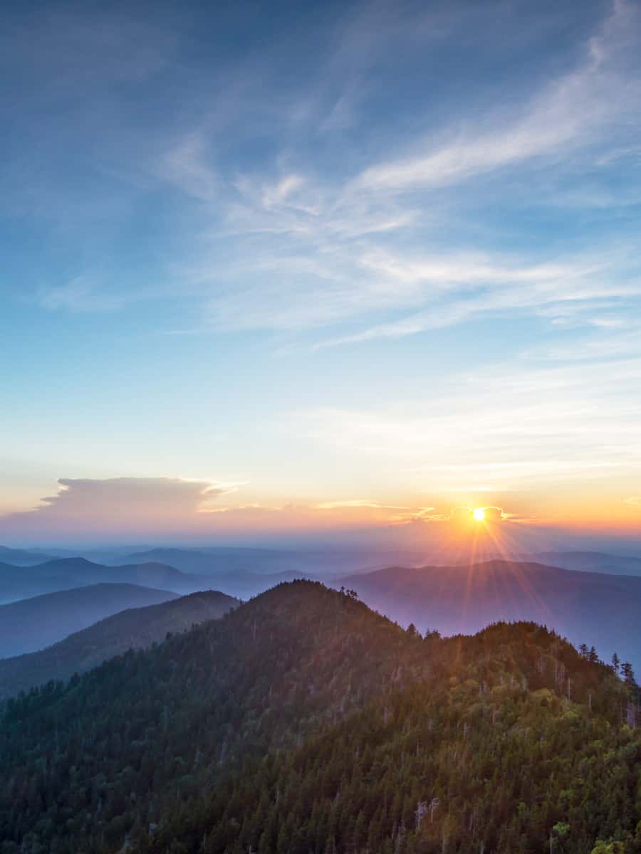 Sunrise highlights gathering mist between the ridges surrounding the Cliff Tops on Mt. LeConte, in the Great Smoky Mountains National Park