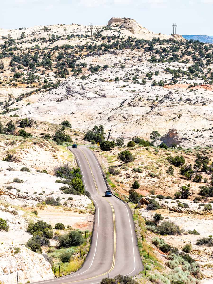Vertical view of highway 12 scenic byway with car on winding road in Calf Creek Recreational Area and Grand Staircase Escalante National Monument in Utah