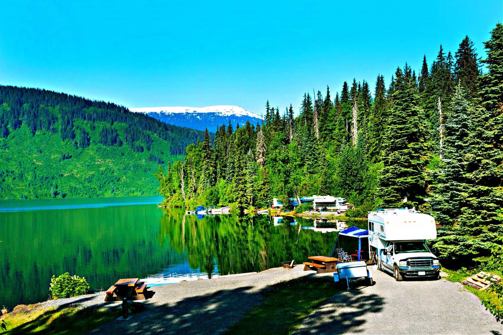 Camping by the beautiful mountain lake in the summer along Alaska Highway