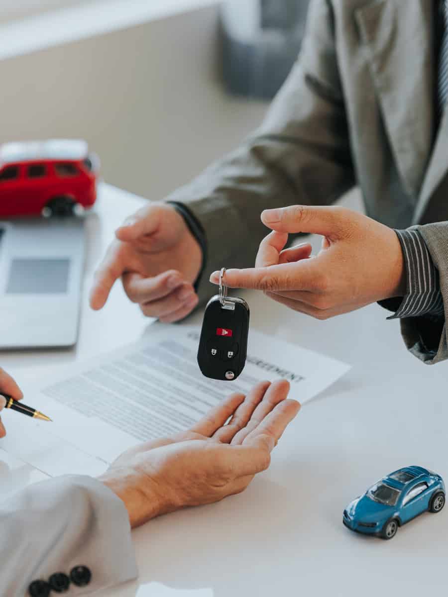 Car rental company service business, dealer hand giving, holding car keys to tenant customer
