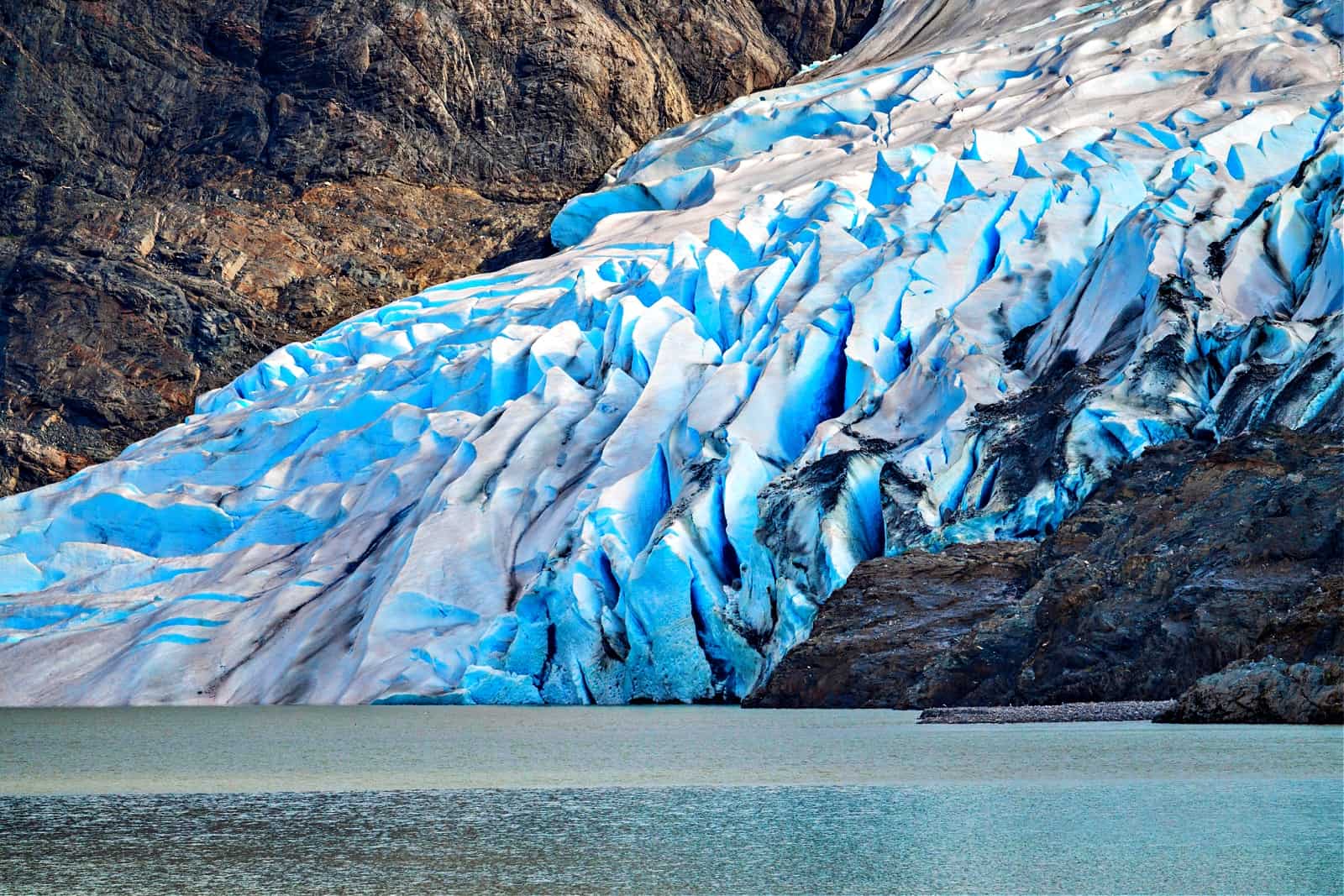 Close up of crevasses on the Mendenhall Glacier as it enters lake close to Juneau in Alaska