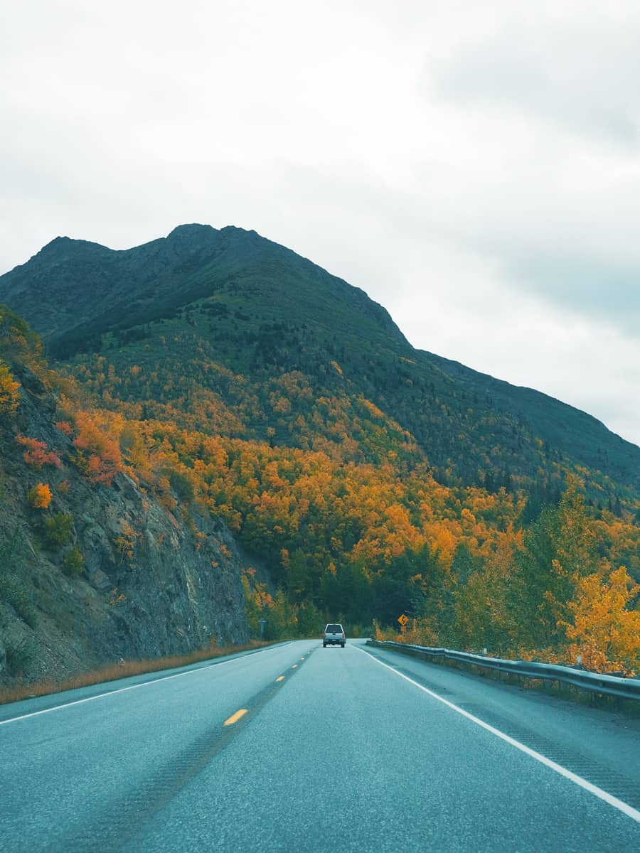 Glenn Highway road driving from Anchorage to Seward with autumn colors and mountains