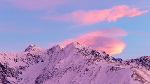 Pink sunrise in the Chugach Mountains in Girdwood, Alaska in winter 1600x900