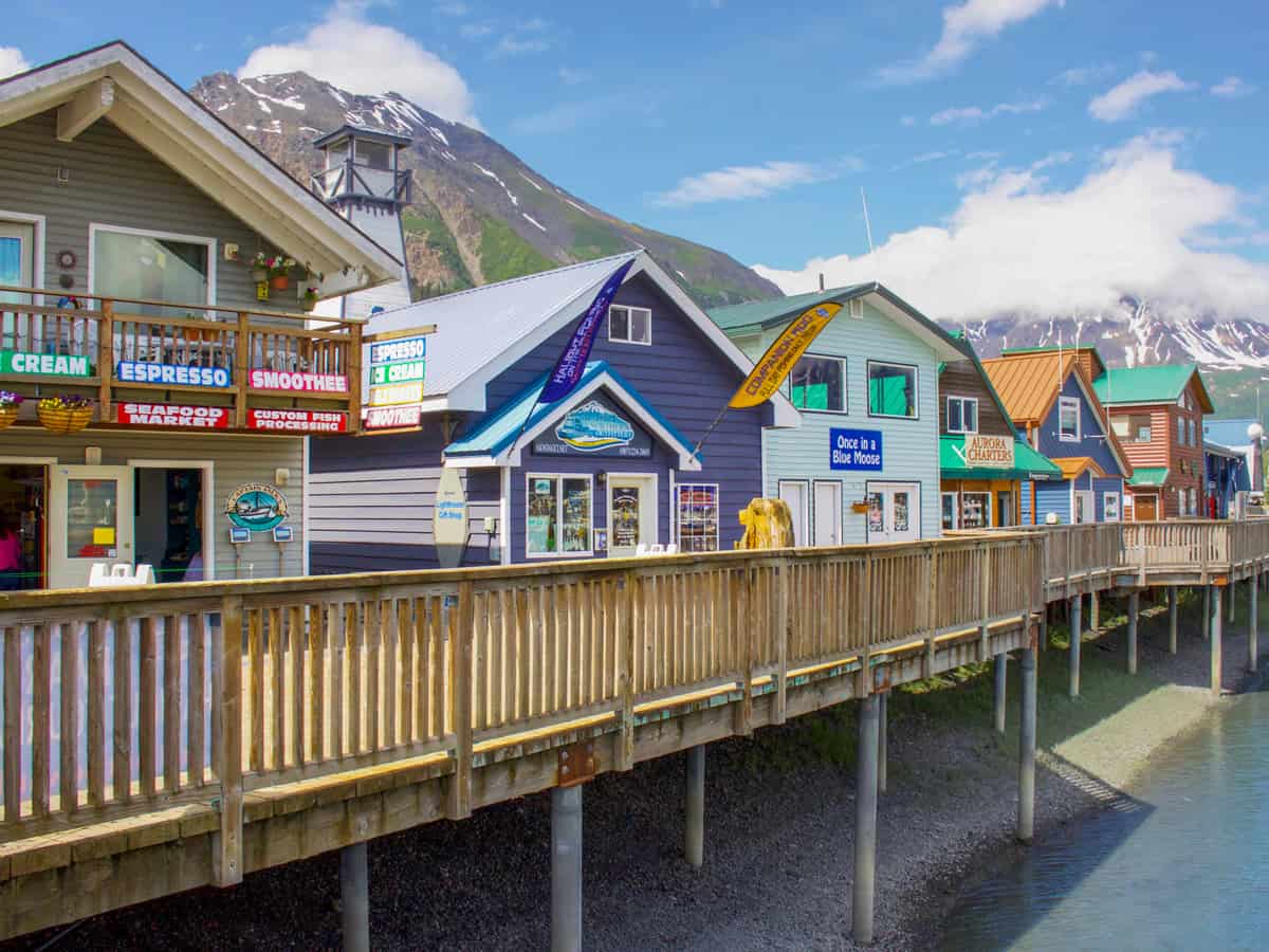 Shops along the dock in Seward Harbor in Resurrection Bay in Seward, Alaska, USA