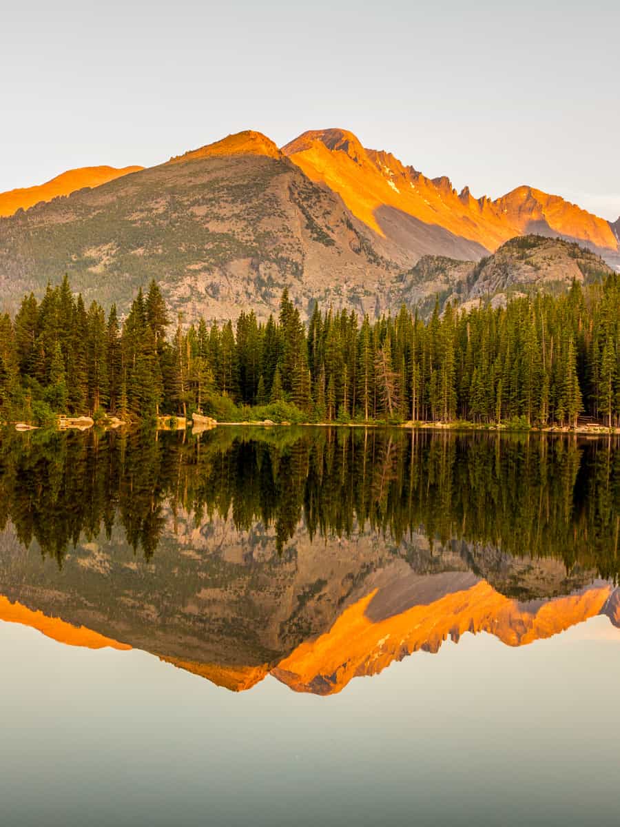 Sunset lake reflection of mountains at Bear Lake in Rocky Mountain National Park, Colorado