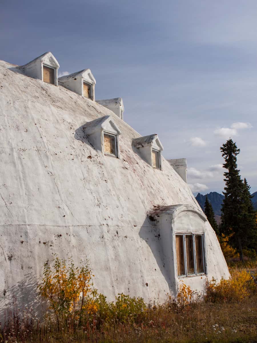The famous abandoned Igloo City Hotel stands in the middle of nowhere by the Highway 3.