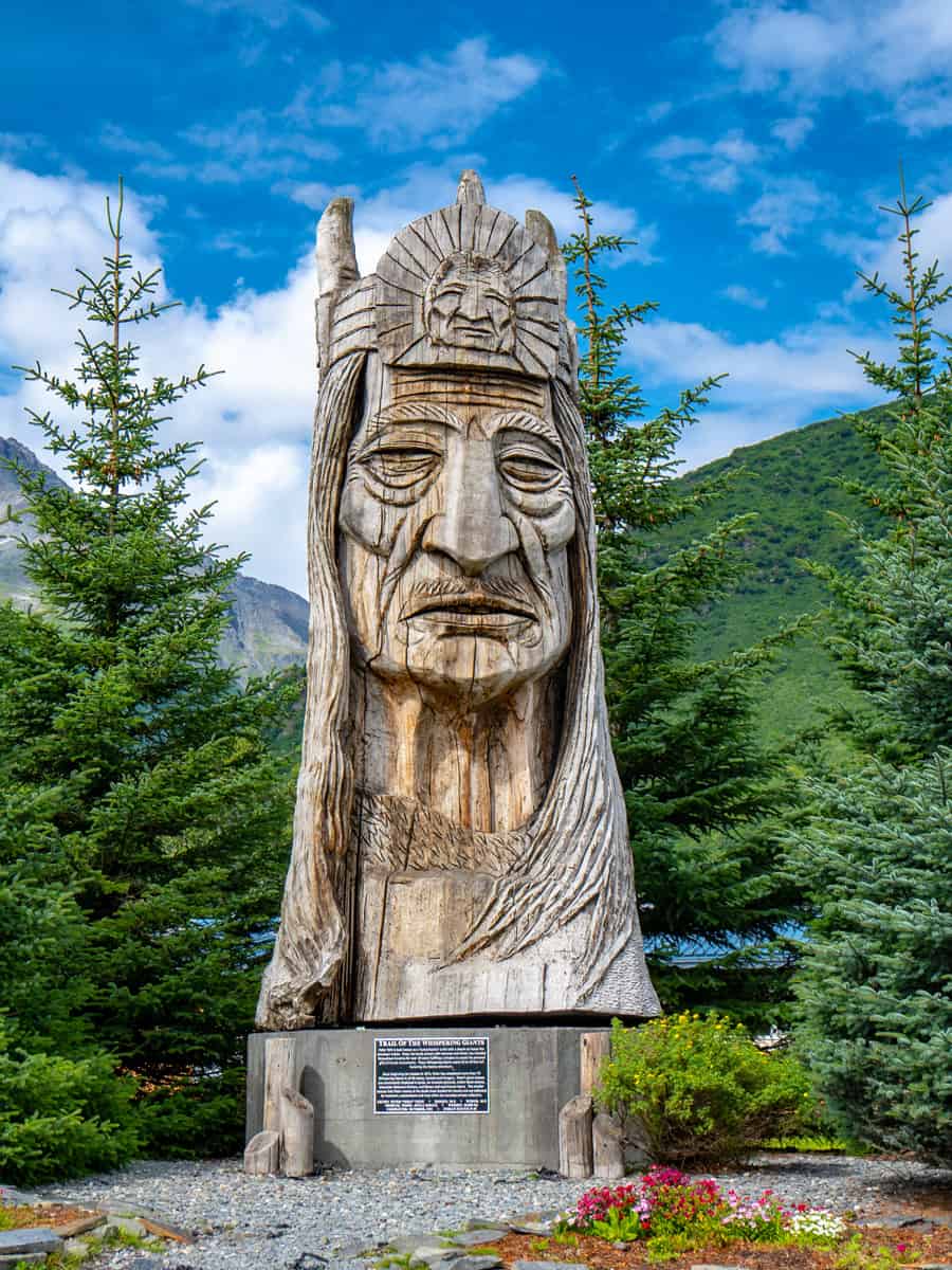 Trail of the Whispering Giants totem pole statue in Valdez Alaska, by artist Peter Wolf