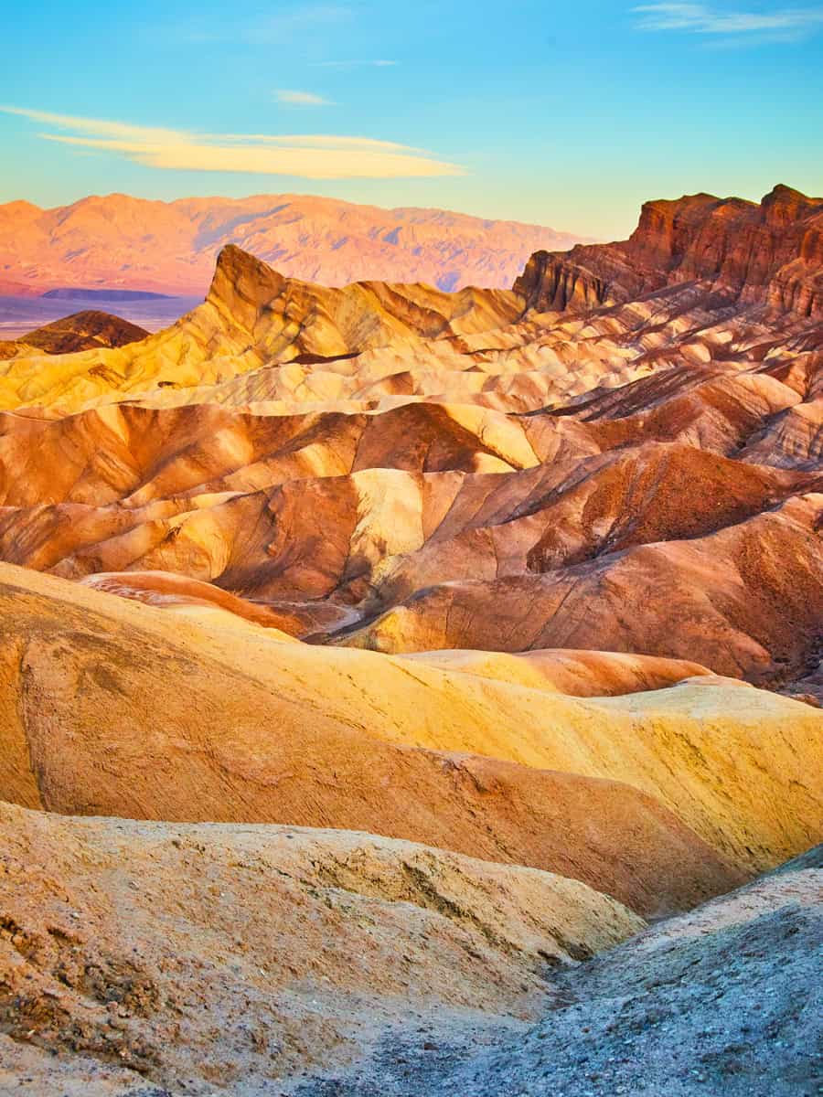 Iconic sunrise colorful waves at Zabriskie Point in Death Valley National Park