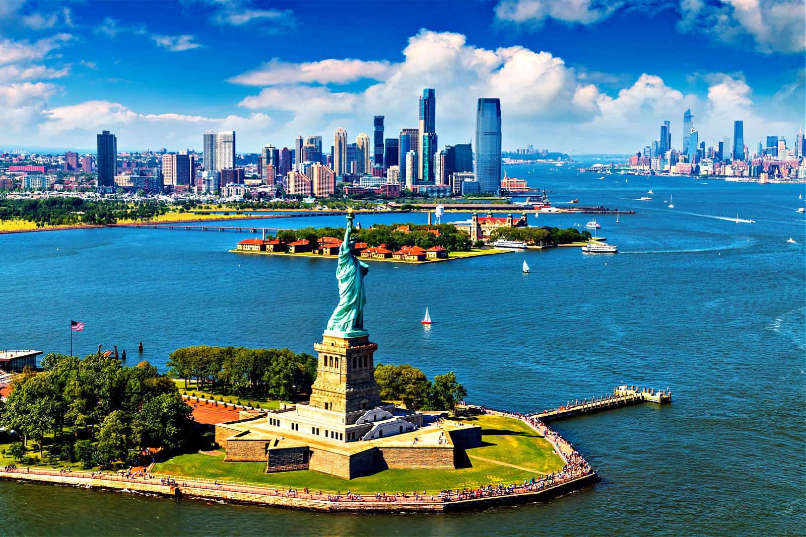 Panoramic aerial view Statue of Liberty and Jersey City and Manhattan cityscape in New York City, NY, USA