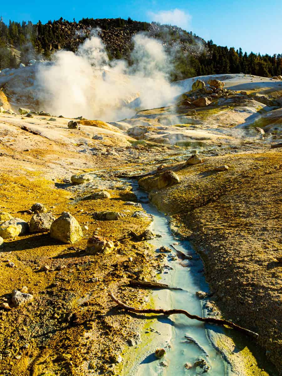 Small stream and boiling mud pot at Bumpass Hell in Lassen Volcanic National Park in northern California, USA.