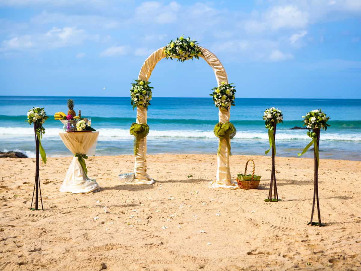 exotic ceremony wedding european style arch on the tropical beach

